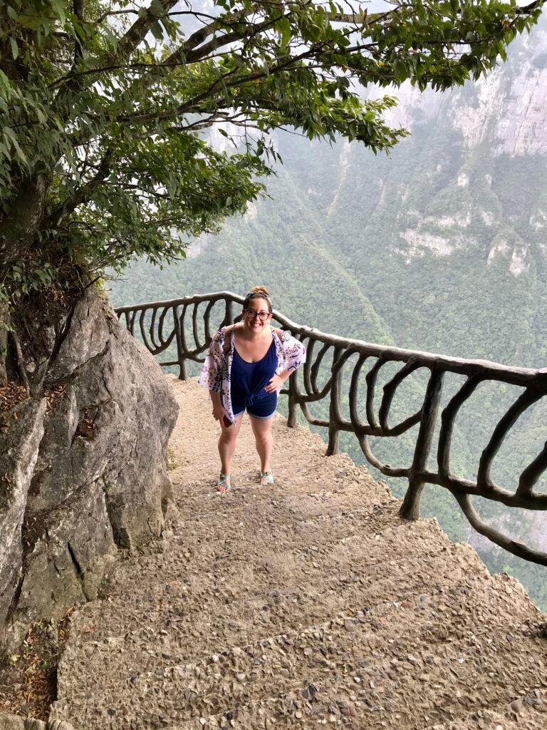 Climbing steep mountain steps in Zhangjiajie National Forest Park, China.