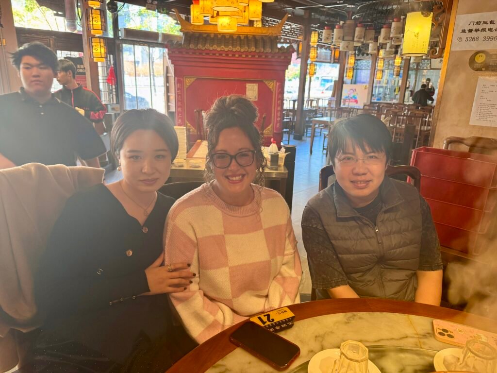 Sharing dinner with friends at a restaurant in China.